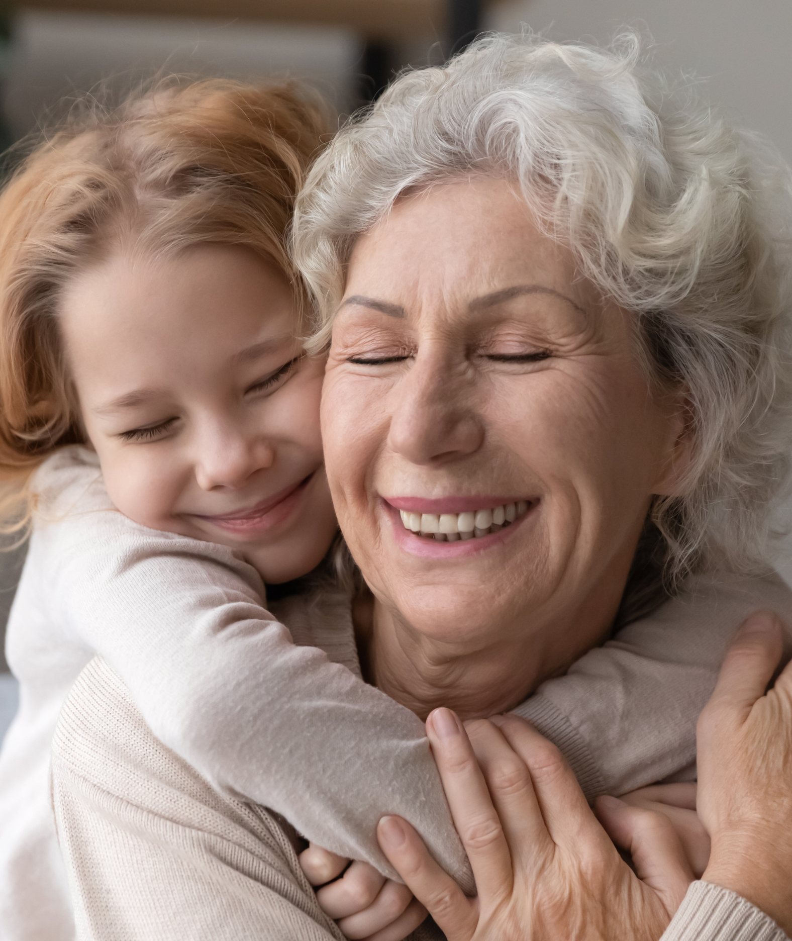 A grandmother holding her grandchild