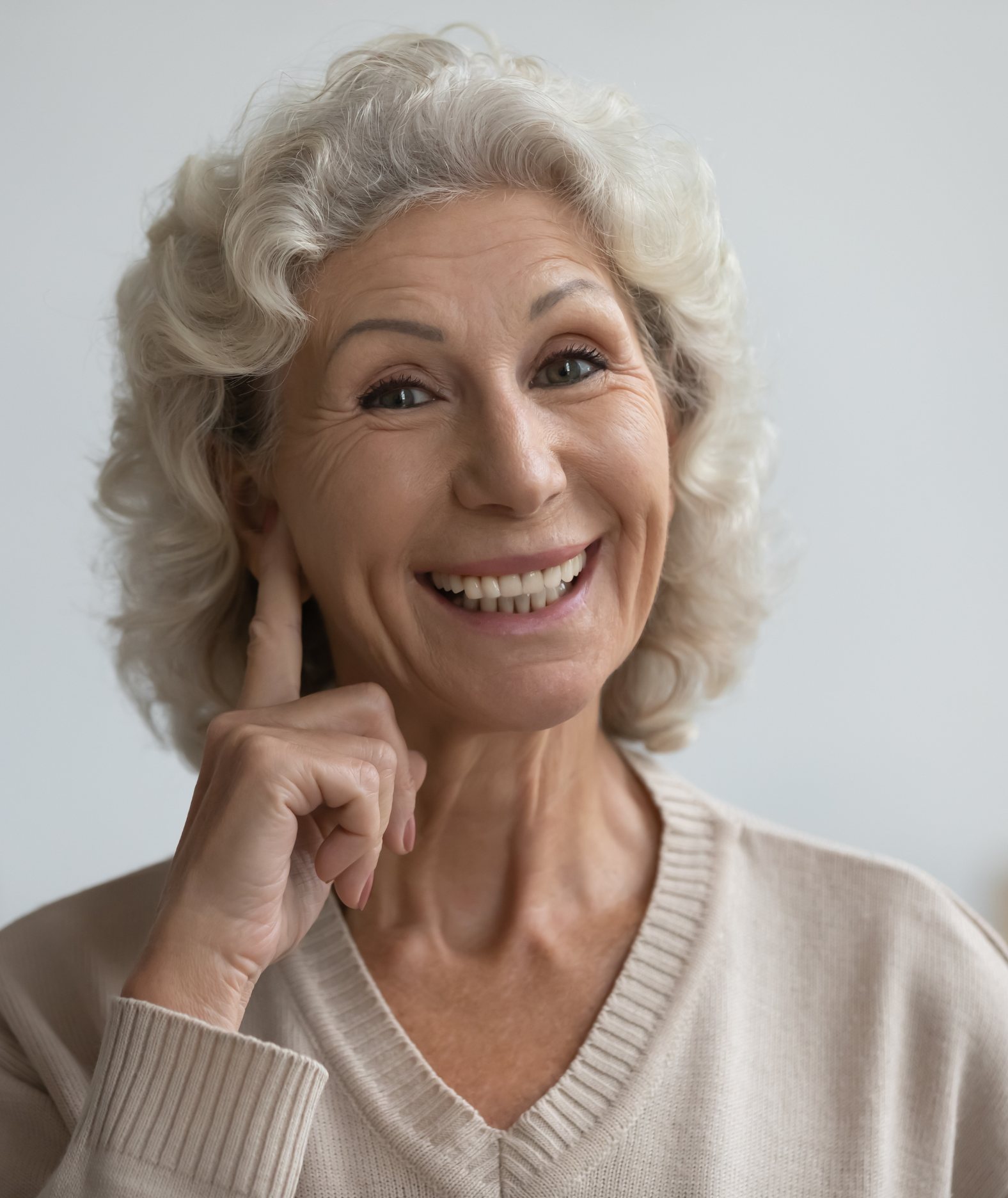 An older woman smiling at home